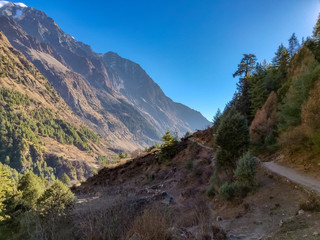 Narrow trekking trail on the ridge of a mountain in Nepal. Manaslu Conservation Area
