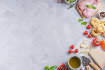 Italian food cooking ingredients. Pasta, vegetables, spices. Top view with copy space