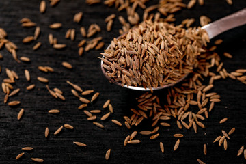 Cumin Seeds on black background