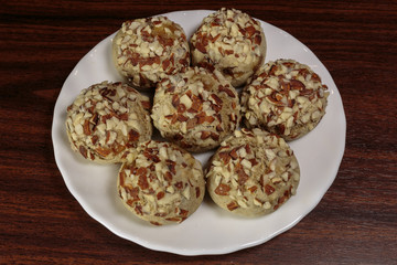 Traditional oriental ginger cookies on the wooden table.  Gingerbread with nuts, almonds, sage and saffron.