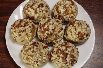 Traditional oriental ginger cookies on the wooden table.  Gingerbread with nuts, almonds, sage and saffron.