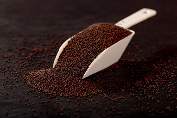 mustard seed on black background