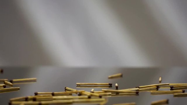 Matches fall on the glass surface