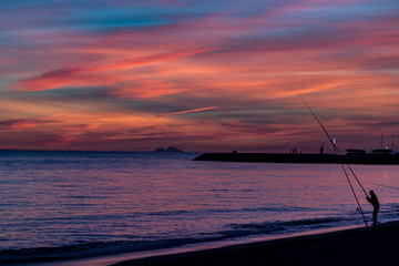 Fishermen and sunset
