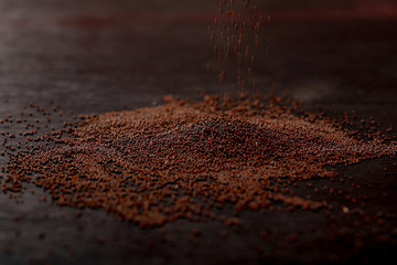mustard seed on black background