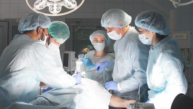 Surgeons perform a complex operation to save a human life at hospital