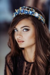 Fashion brunette girl with jewelry precious decorations.