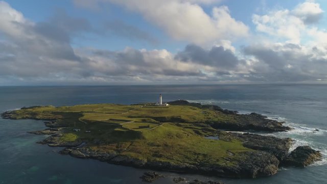 Stunning Aerial Shot in Scottish Highlands, Portnahaven lighthouse on the Isle of Islay