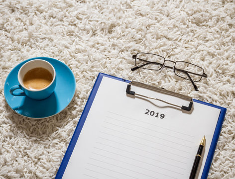 Plans for 2019 on board with coffee and glasses