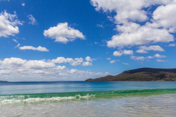 Wave breaking on Adventure Bay beach Tasmania, Australia