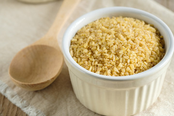 Bulgur groats in ceramic dishes