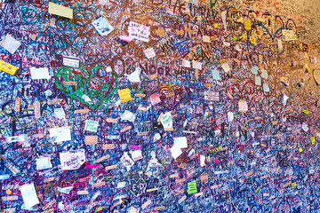 Wall full of lovers wishes at house of Juliet Capulet in Verona in Italy / Writings on a wall 