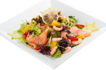 Salad with salmon and shrimp. On a white background