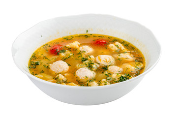 Soup with turkey meatballs. On a white background
