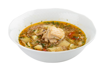 Chicken soup with buckwheat groats. On a white background