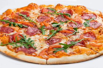 Pizza with salami and bell peppers. On a white background