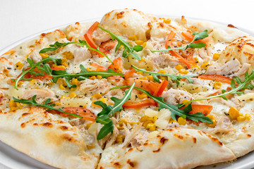 Pizza with chicken and pineapple. On a white background