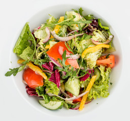 Fresh vegetable salad. On a white background