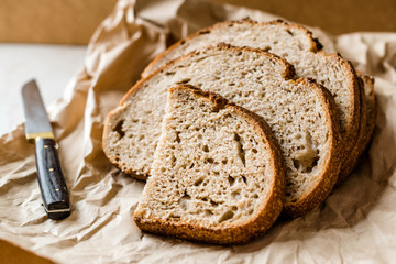 Artisan Sliced Homemade Sourdough Bread Slices with Paper Bag / Package or Craft Paper.