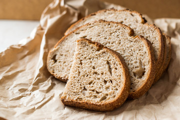 Artisan Sliced Homemade Sourdough Bread Slices with Paper Bag / Package or Craft Paper.