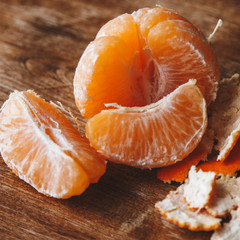 Peeled tangerine and tangerine slices