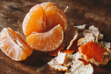 Peeled tangerine and tangerine slices