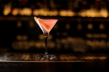 Elegant cocktail glass filled with sweet and tasty pink drink