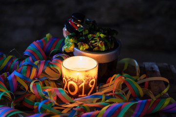 new year's day candle 2019, paper streamers and lucky clover