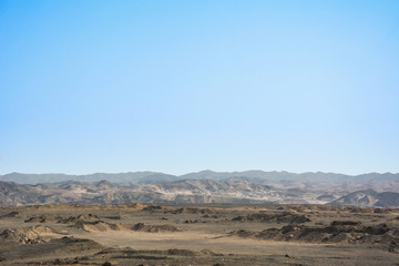 Fototapeta na wymiar Dry egyptian desert landscape under blue sky