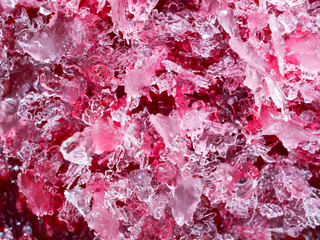 Pink ice crystal formations, frozen water, macro closeup, top view