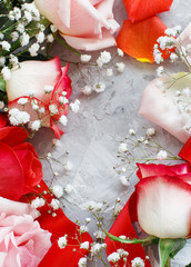 Red roses and small white flowers with ribbon