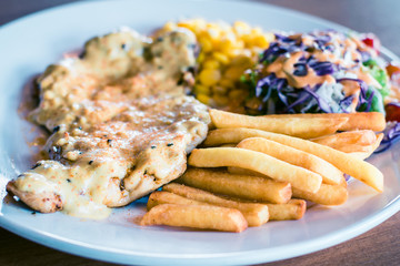 Honey Mustard Chicken Chop with french fries, sweet corn and salad
