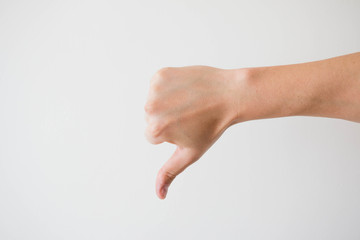 Male hand thumb down on a white background