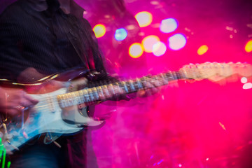 Obraz na płótnie Canvas Electric guitar player shaky blurred multiples exposure