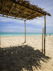 Palapa (tiki hut) used for shade at a bar in Pilar beach - Ilha de Itamaraca (Pernambuco state, Brazil)
