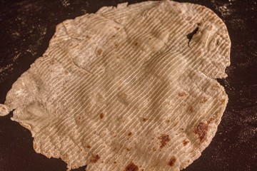 Traditional Scandinavian Lefse Dough is rolled and cooked on a Griddle