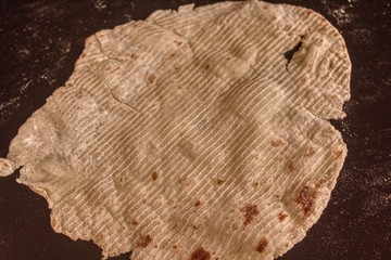 Traditional Scandinavian Lefse Dough is rolled and cooked on a Griddle