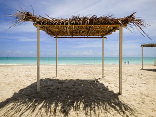 Palapa (tiki hut) used for shade at a bar in Pilar beach - Ilha de Itamaraca (Pernambuco state,...