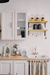 The interior of the bright kitchen in the Scandinavian style