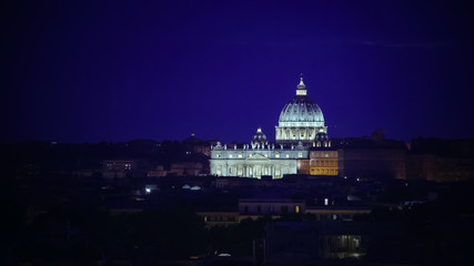Beautiful shot of St Peter Papal Basilica brightly illuminated at night, Vatican
