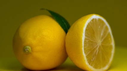 Naklejka na ściany i meble Fresh lemon fruits macro view, citric acid, refreshing lemonade ingredient, diet