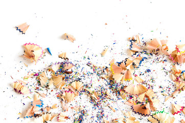 Pile of colored pencil shavings. Copy space, flat lay