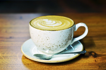 Сup of coffee on table in cafe