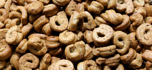 background of many baked rings called Taralli in Italian Languag