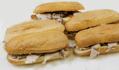 five sandwiches stuffed with roast pork for sale in the street f