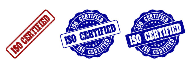 ISO CERTIFIED grunge stamp seals in red and blue colors. Vector ISO CERTIFIED watermarks with grainy effect. Graphic elements are rounded rectangles, rosettes, circles and text tags.