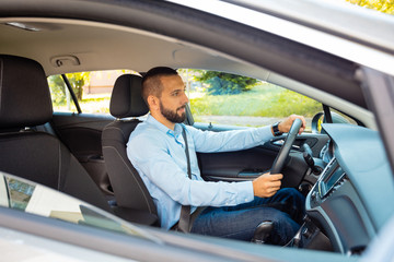 Businessman driving a car
