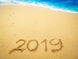 Year 2019 on the beach for background