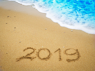 Year 2019 on the beach for background