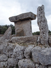 Talaiot de Trepuco megalithic t-shaped Taula monument in sunny day it Menorca SpainTalaiot de Trepuco megalithic t-shaped Taula monument and standing stone in Menorca Spain